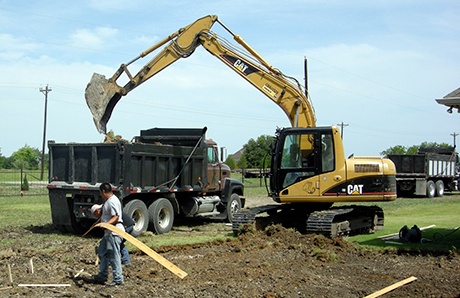 5.excavator-and-dump-truck-building-swimming-pool.jpg