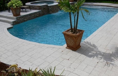 pool-with-raised-spa-and-concrete-paver-deck.jpg