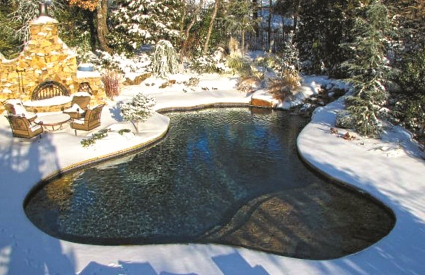 Swimming pool surrounded by snow