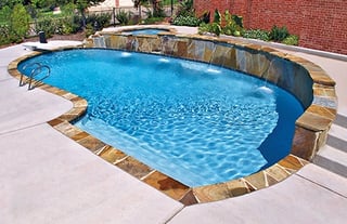 pool-with-raised-bond-beam-wall-flagstone.jpg