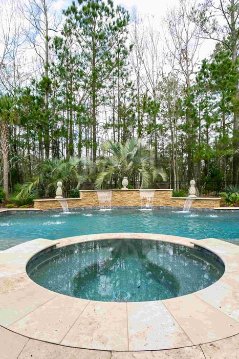Blue Haven gunite pool with raised spa and cascading waterfall features