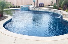 free-form-pool-with-dark-blue-interior-finish