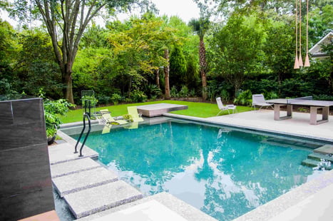 Custom Blue Haven gunite pool with entry steps and backyard patio design