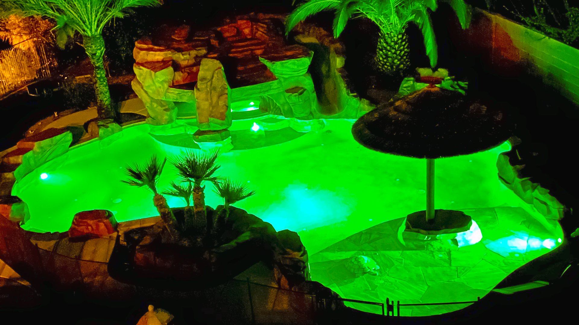 a-lagoon-pool-with-green-lighting