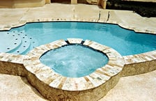 quatrefoil-shape-custom-spa-with-travertine-exterior.jpg