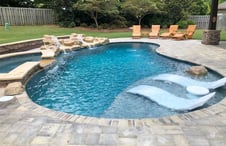 accent-boulder-on-pool-tanning-ledge