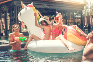 adults-in-swimming-pool-with-float