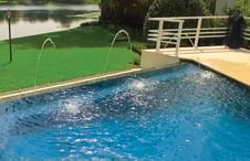 arching-water-features-on-pool-deck