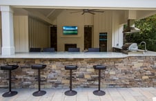 bar-seating-at-deluxe-outdoor-kitchen