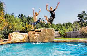 boys-jumping-into-pool