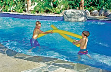 boys-playing-on-pool-tanning-ledge
