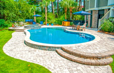 curvey-pool-with paver-deck