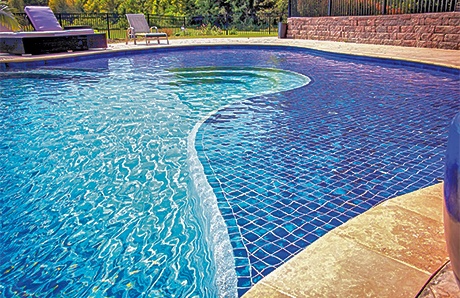 Custom Pool With Baja Shelf Covered in Blue Tile