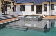 custom-pool-with-spa-surrounded-by-custom-sun-shelf