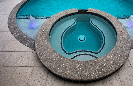 custom-spa-with-grey-coping-and-rectangular-pavers.jpg