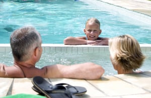 family-enjoying-pool-and-spa