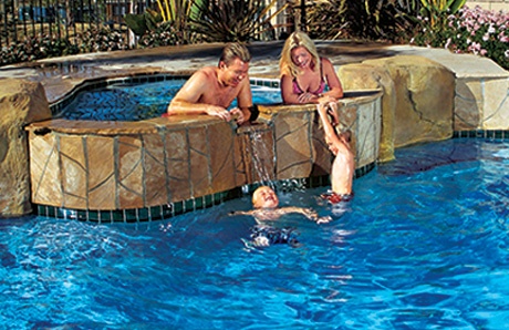 Family In Swimming Pool And Apa