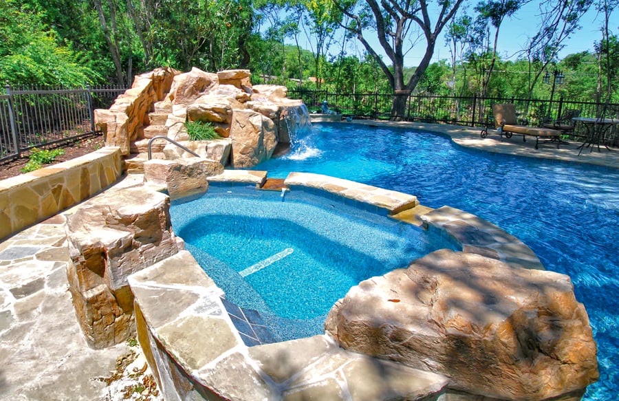 faux-stone-boulders-around-organic-shaped-spa