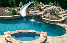 free-form-pool-spa-with-white-slide-waterfall