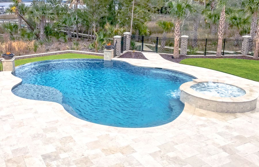 free-form-pool-with-fire-bowls-tanning-shelf