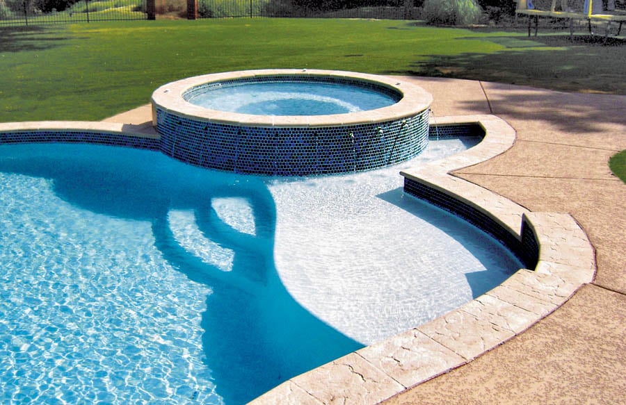 Free Form Pool With Round Spa And Curved Baja Shelf