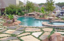 free-form-pool-with-stone-grass-deck