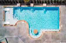 geometric-inground-pool-with-table-bar-seating