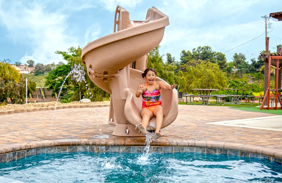 girl-on-corkscrew-pool-slide