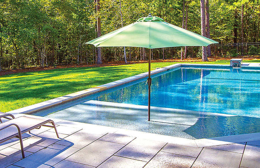 green-umbrella-on-swimming-pool