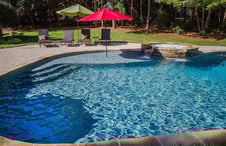 gunite-pool-with-tanning-ledge-and-umbrella