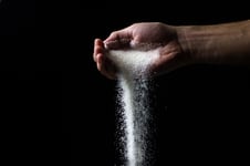 hand-pouring-salt