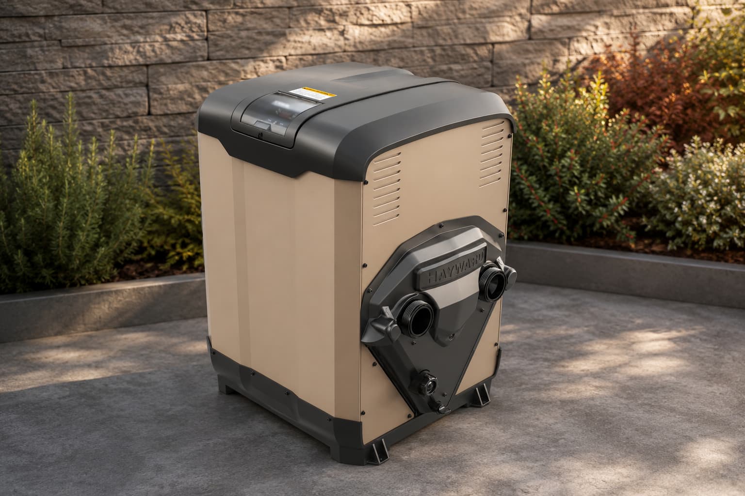 Hayward gas pool heater unit installed on concrete pad next to stone wall and landscaping