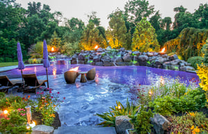 illuminated-pool-with-stone-waterfall