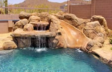 faux-rock-waterfall-with-slide-pool-on-pool