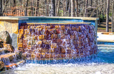 stacked-stone-facade-onround-gunite-spa