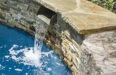 metal-scupper-water-feature-on-swimming-pool