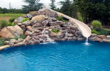 natural stone waterfall pool slide