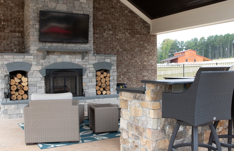 outdoor-living-room-with-fireplace-and-TV-1