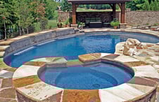 pool-spa-with-flagstone-deck-and-cascade-water-features