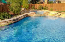 pool-spa-with-stone-covered-raised-beam