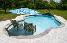 pool-with-tanning-ledge-and-chairs