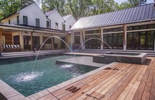 pool-with-wood-deck-and-laminar-water-features