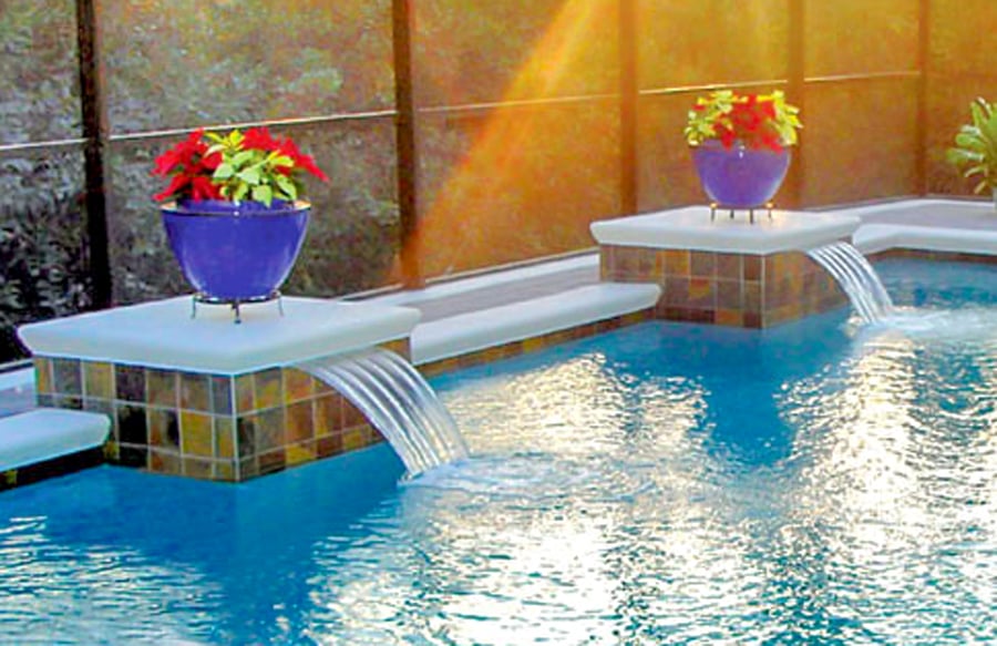 potted-flowers-atop-pedestals-on-inground-pool
