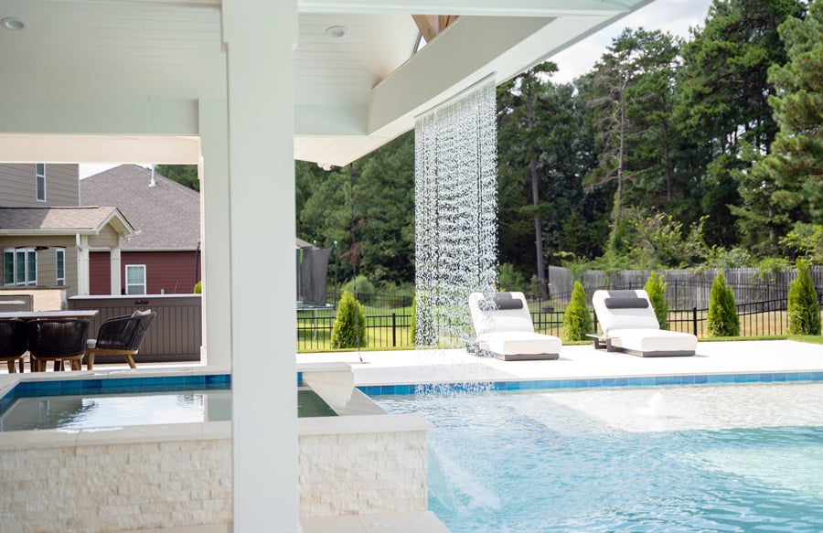 rain-curtain-on-roof-beam-over-square-spa