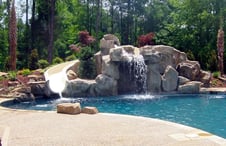 rock-waterfall-with-slide-on-pool