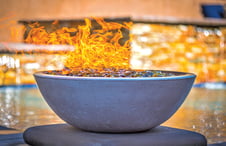 round-concrete-fire-bowl-on-pool