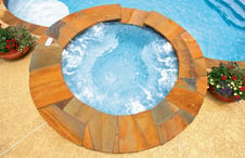 round-flagstone-covered-spa-on-pool