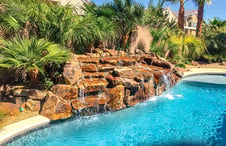 small-double-fall-rock-waterfall-on-pool