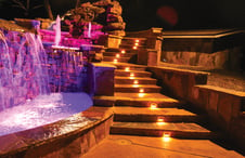 stairway-on-pool-deck-at-night-with-lights