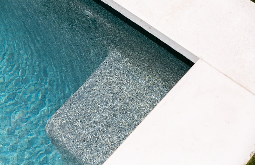 Swimming Pool Bench With Pebble Finish Jpg ?width=900&height=582&name=swimming Pool Bench With Pebble Finish Jpg 
